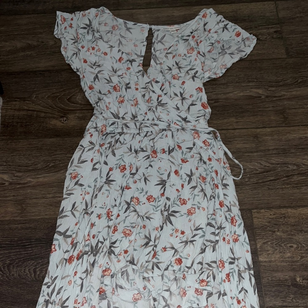 This is a blue flowey romper that has a trail in the back.